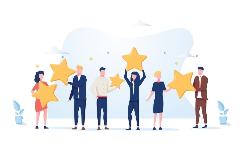 A group of people holding gold starts image